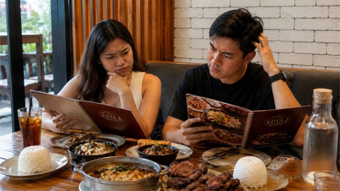 Filipino couple looking confused while choosing food from a restaurant menu