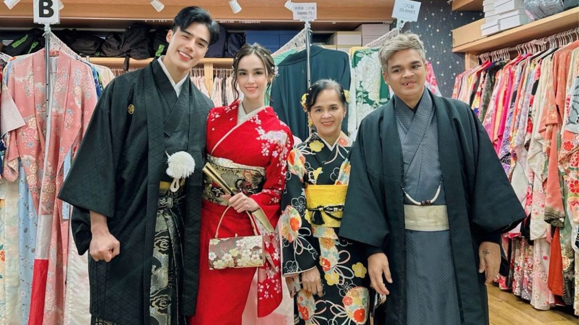 Kim Domingo poses in traditional Japanese attire with companions during a trip amid discussions about celebrity privacy online.