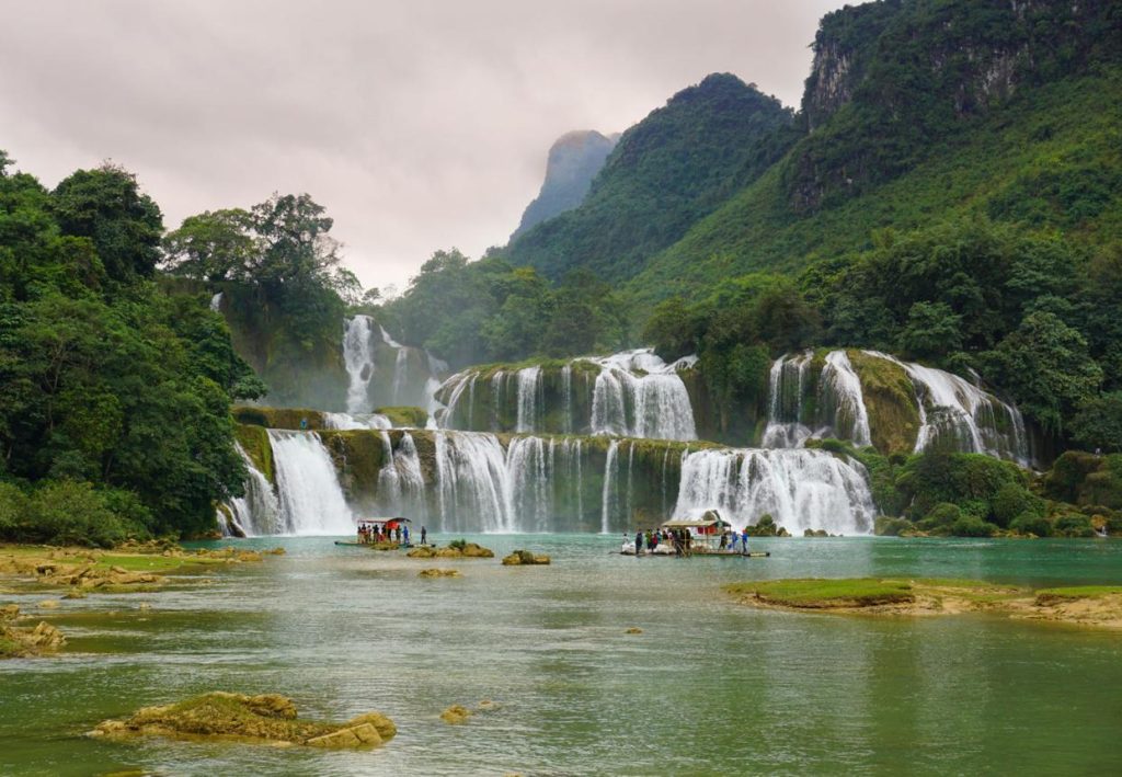 Ban Gioc Waterfall cascading over wide limestone tiers along the Vietnam-China border in Cao Bang Province.