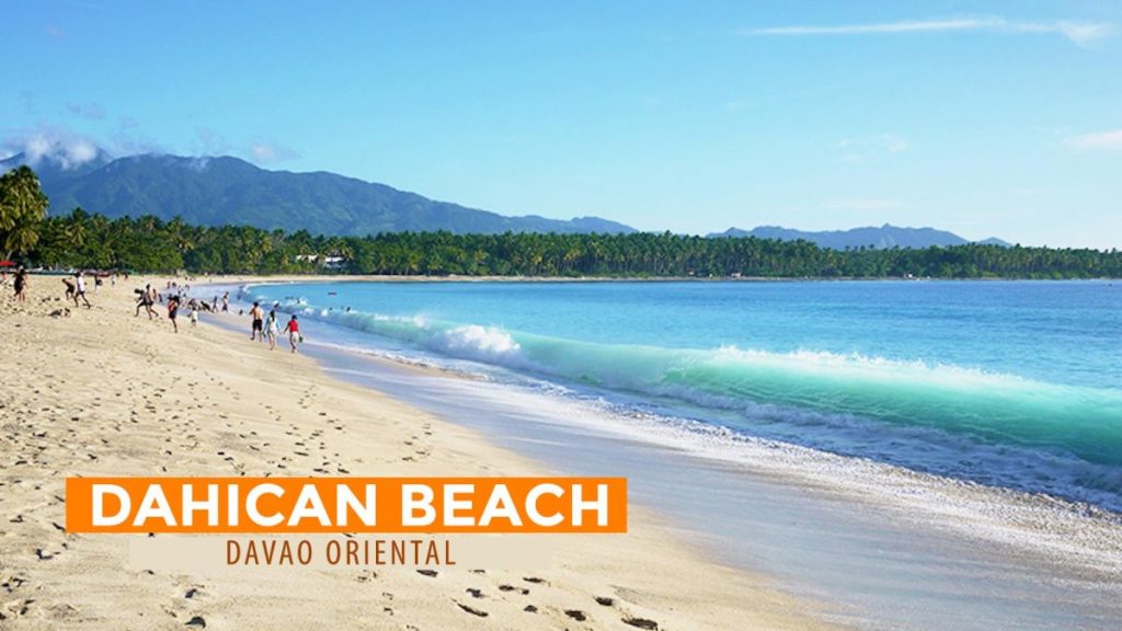 Waves rolling onto the white-sand shoreline of Dahican Beach in Mati City, Davao Oriental, Philippines.