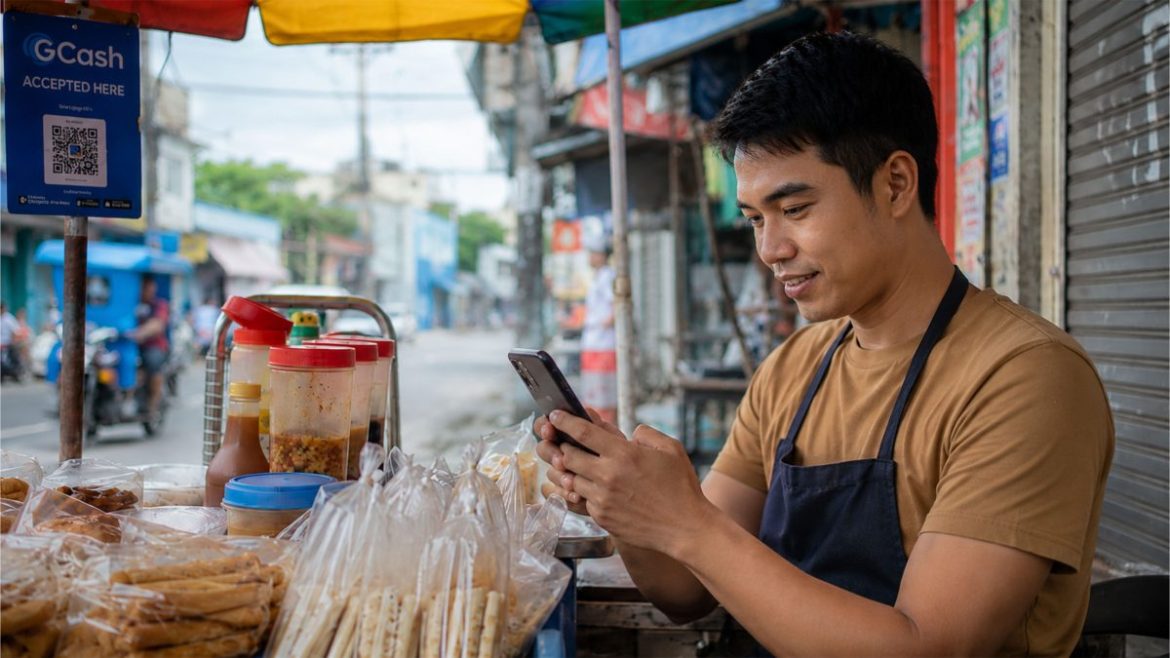 Filipino street vendor using a smartphone and digital payment system while managing a small food stall.
