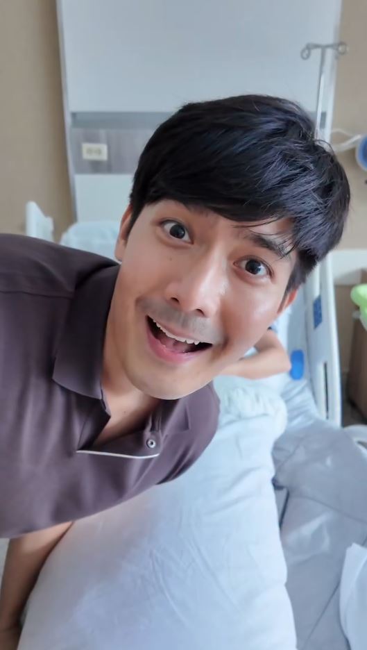 Robi Domingo smiles excitedly inside a hospital room following the birth of his first child.