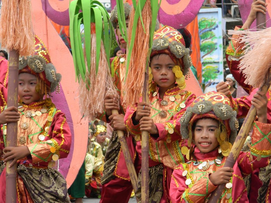 Young performers wearing colorful indigenous-inspired costumes during the Kadayawan sa Dabaw Festival.